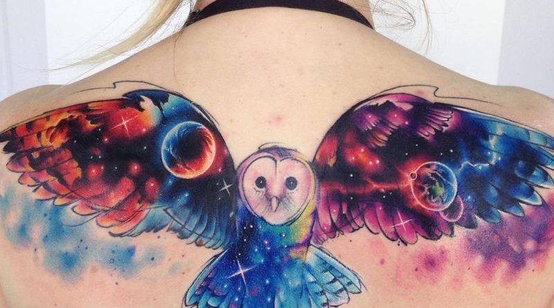 цветная сова в космическом стиле татуировка