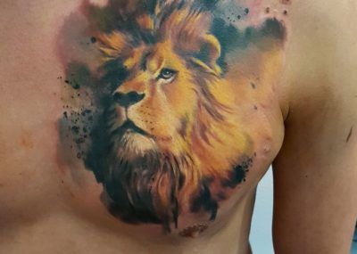Мужские тату на груди лев