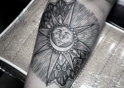 Blackwork sun tattoo